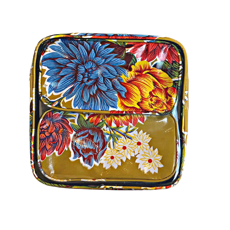 Front view: Two small travel cases, multi-colored flower print on mustard background, fitting inside large case.