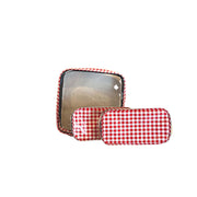 Front view: One large case and two small travel cases, white and red checkered pattern.