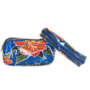 Front view: Two small travel cases, multi-colored floral print on blue background.