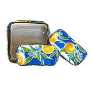 Front view: One large case and two small travel cases, multi-colored orange fruit and blossom print on blue background.