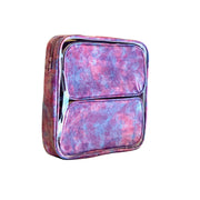 Side view: Two small travel cases, blue, pink and purple splatter print, fitting inside large case.