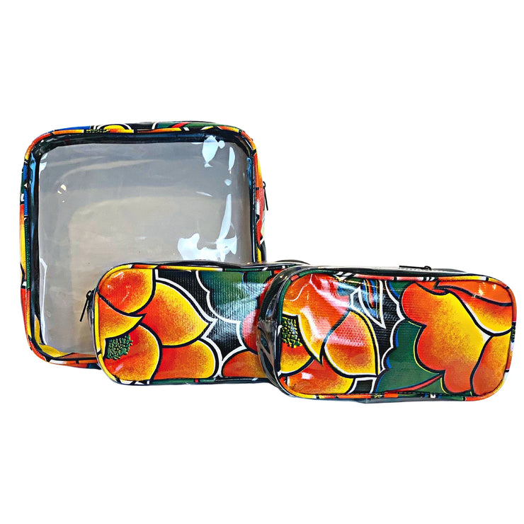Front view: One large and two small travel cases, multi-colored floral print on black background.