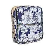 Side view:  Two small travel cases, white floral print on blue background, fitting inside the large case.
