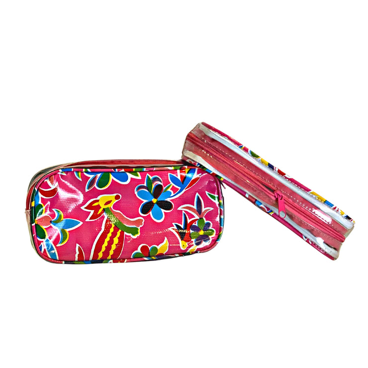 Front view: Two small travel cases, multi-colored flower/animal print on pink background.