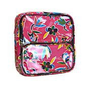 Front view: Two small travel cases, multi-colored flower/animal print on pink background, fitting in large case.