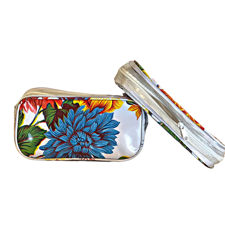 Front view: Two small travel cases, multi-colored flower print on white background.