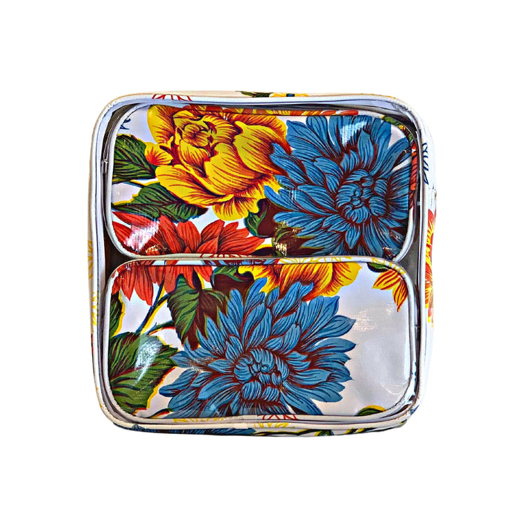Front view: Two small travel cases, multi-colored flower print on white background, fitting inside large case.
