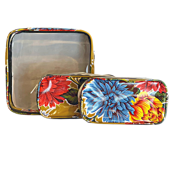 Front view:  One large case and two small travel cases, multi-colored flower print on mustard background.