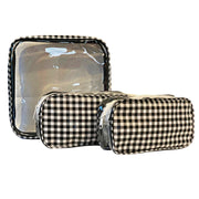 Front view: One large case and two small travel cases, white and black checkered pattern.