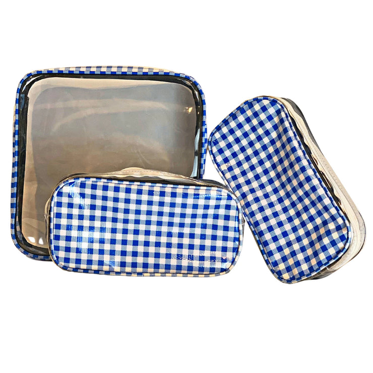 Front view: One large case and two small travel cases, white and blue checkered pattern.