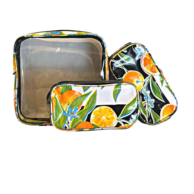 Front view: One large case and two small travel cases, multi-colored orange fruit and blossom print on black background.
