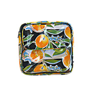 Front view: Two small travel cases, multi-colored orange fruit and blossom print on black background, fitting inside large case.
