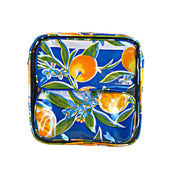 Front view: Two small travel cases, multi-colored orange fruit and blossom print on blue background, fitting inside large case.