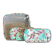 Front view: One large case and two small travel cases, multi-colored cherry blossom print on green background.