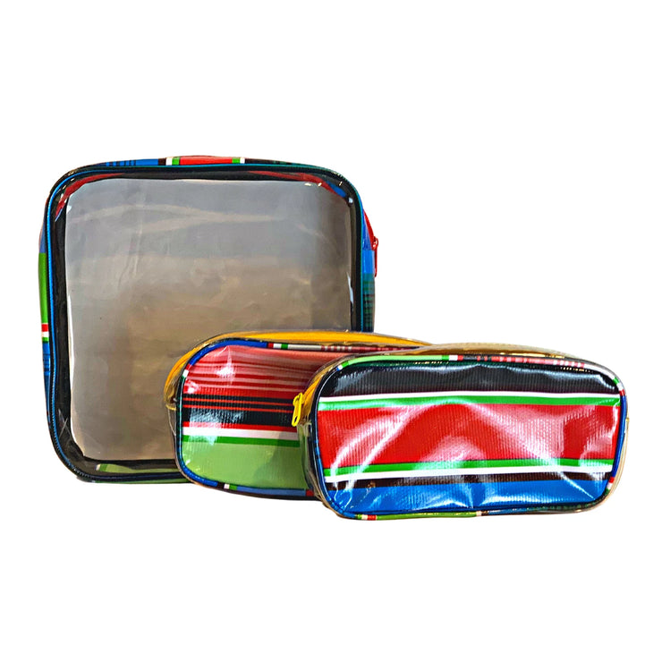 Front view:  One large case and two small travel cases, multi-colored horizontal stripe pattern.