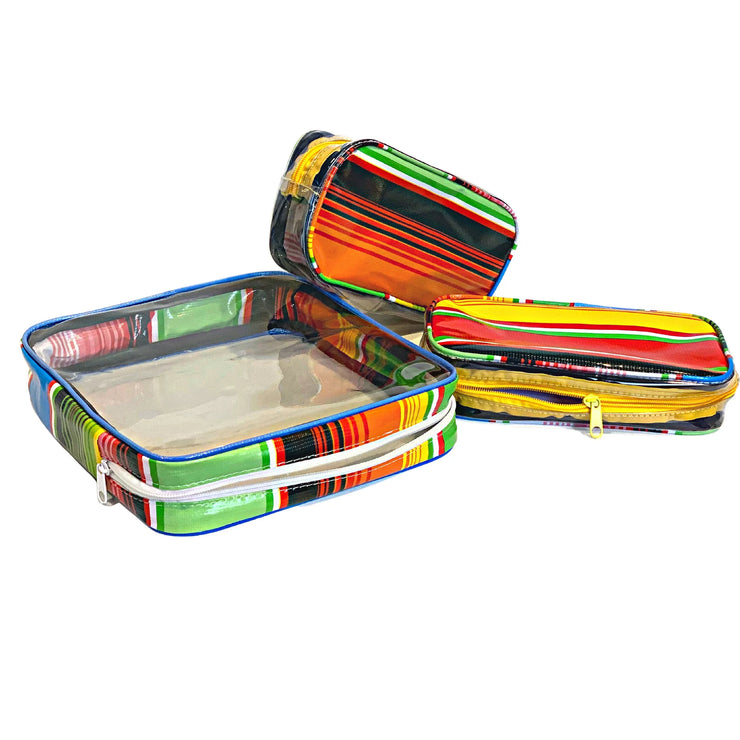 Above view:  One large case and two small travel cases, multi-colored horizontal stripe pattern.