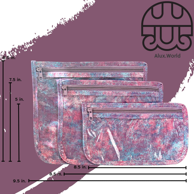 Front view: Small, medium and large slim travel bags, pink zippers and pink, blue and purple splatter print, with dimensions.