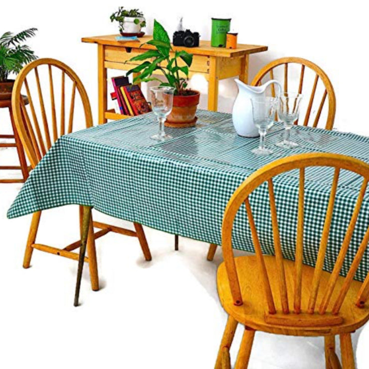 Side view: Green and white checkered pattern tablecloth covering table, potted plant centerpiece.