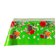 Side view: Multi-colored floral print on green background tablecloth, covering table.