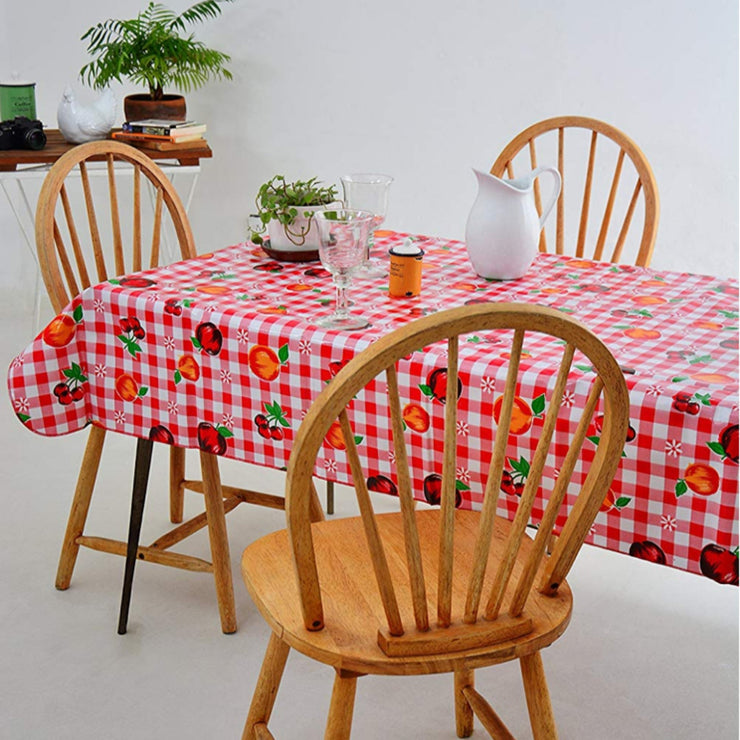 Side view:  Fruit print on red and white checkered background, with potted plant as centerpiece.