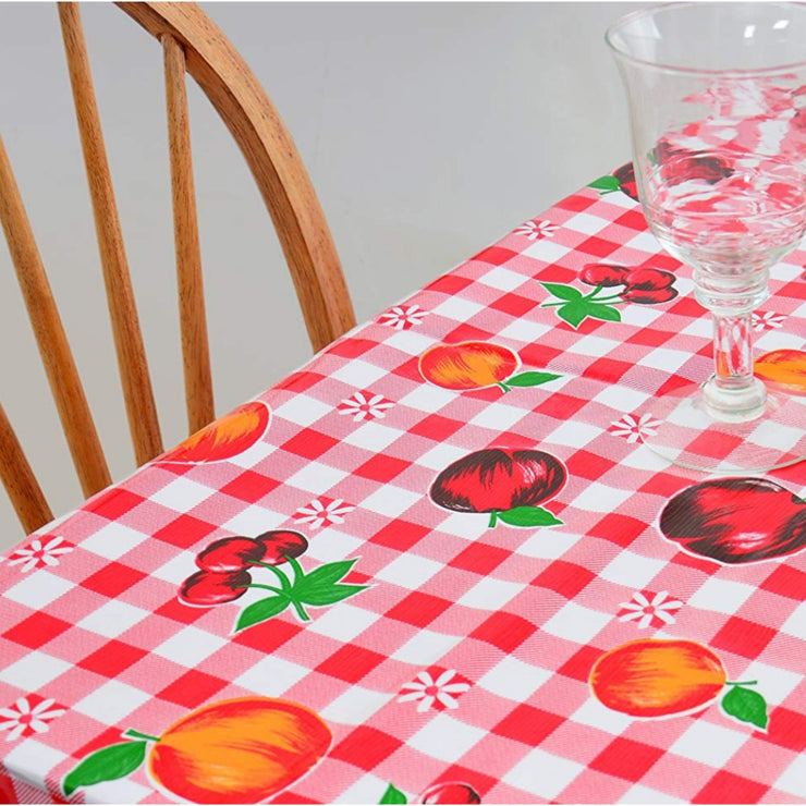 Above view:  Fruit print on red and white checkered background, covering table.