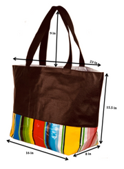Angle view: Brown tote with multi-color striped pattern base with brown grab handles, with dimensions. 