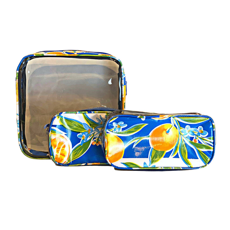 Front view: One large case and two small travel cases, multi-colored orange fruit and blossom print on blue background.