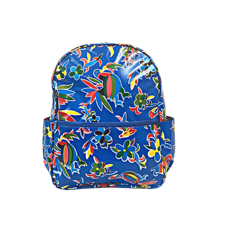 Front view: Otomi backpack with multi-colored flower/animal print on blue background.