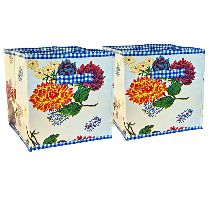 Front view: Two collapsable storage bins, multi-colored flower print on white background.