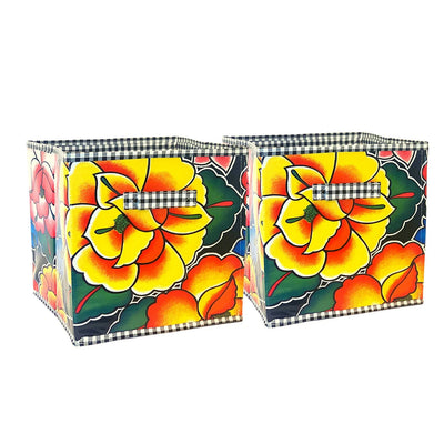 Front view: Two collapsable storage bins, multi-colored floral pattern.