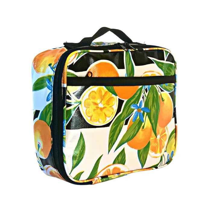 Angle view: Orange fruit print on black and white background lunchbox.