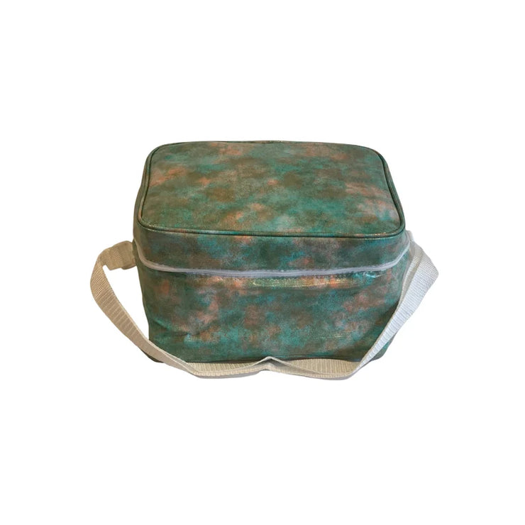 Front view: Green, orange, olive splatter print lunchbox with cream strap handle.